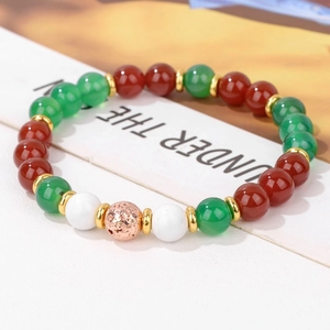 Detail view of natural stone beaded bracelet with red agate and green chalcedony beads