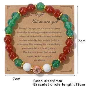 Detail of 8mm natural stone bead bracelet with rose gold charm on inspirational card