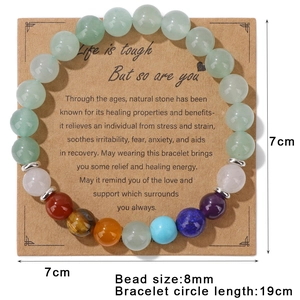 Elastic natural stone bead bracelet with 8mm chakra beads on a brown kraft display card