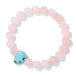 Close-up of pink crystal beaded bracelet featuring a blue turquoise elephant charm