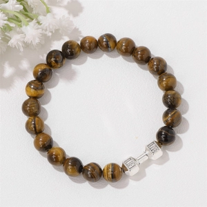 Macro detail of tiger eye beads and silver dumbbell charm with LIFE LIVE engraving