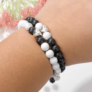 Couples heart beaded bracelets set with white turquoise and matte black stone on wrist