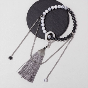 Bracelet chinois en perles de pierre Yin Yang avec pompon gris et breloques vintage