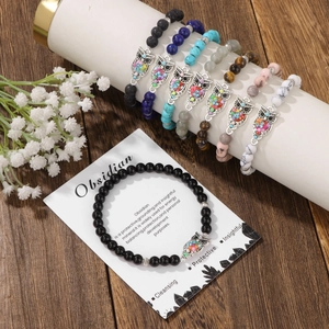 Bracciali elastici bohémien con pietre zebra, ossidiana e ciondoli a gufo