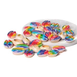 Macro shot of colorful striped shell beads with gold-plated edges for DIY jewelry making
