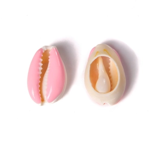 Close-up of pink and cream natural seashell pendants for DIY jewelry and necklaces