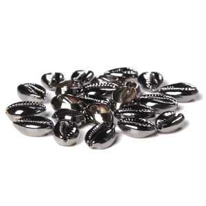 Macro detail of metallic black shell beads with grooved texture for DIY jewelry making