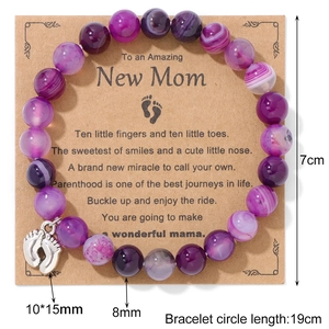 Purple natural stone bead bracelet with baby feet charm on New Mom gift card