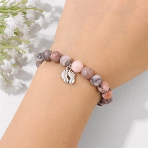 Pink and gray marbled stone beaded bracelet with a silver baby feet charm for women