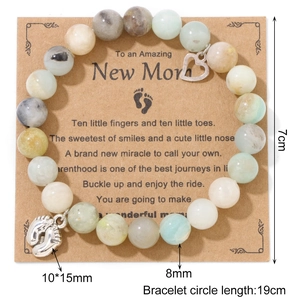 Blue-purple imperial stone beaded bracelet with heart and baby feet pendants on gift card