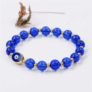 Pulsera elástica de ojo turco con cuentas azules texturizadas y toques dorados