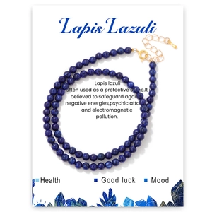 Close-up of 4mm natural lapis lazuli beaded necklace with adjustable gold-tone chain on card