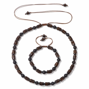 Macro shot of natural wood and lava stone bead set with brown braided cord strings