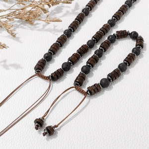Detail of adjustable wood bead bracelet with volcanic stone and woven cord closure