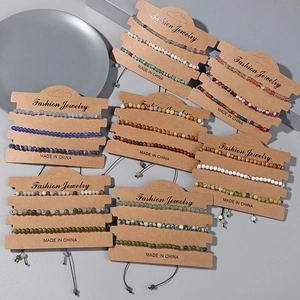 Detail of natural stone bead bracelet set with adjustable drawstring on display card