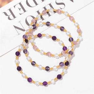 Three-piece amethyst crystal beaded bracelet set with purple cat-eye stones and gold spacers