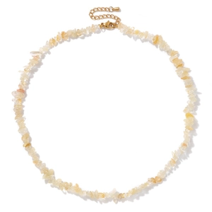 Detailed view of yellow crystal stone necklace with golden lobster clasp and extender