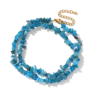 Detailed macro of irregular blue apatite crystal necklace with golden lobster clasp