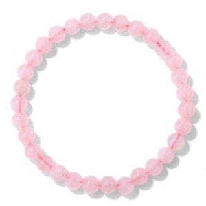 Macro detail of 6mm natural rose quartz crystal beads on an elastic gemstone bracelet