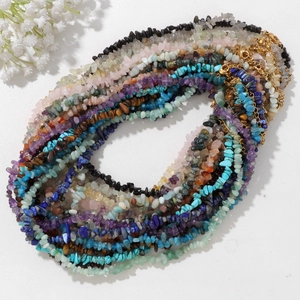 Natural crystal stone necklace set with turquoise and amethyst, featuring gold lobster clasp