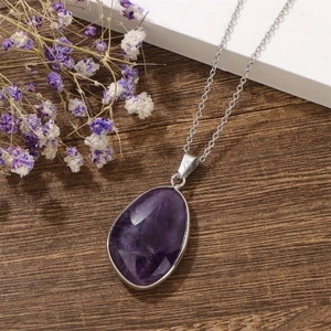 Natural teardrop amethyst pendant necklace with silver stainless steel chain on wood
