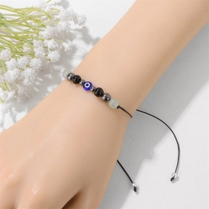 Bracciale Evil Eye fatto a mano con perle occhio di tigre e cordino cerato regolabile