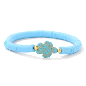 Macro shot of turquoise turtle charm on sky blue Heishi bead bracelet for beach wear