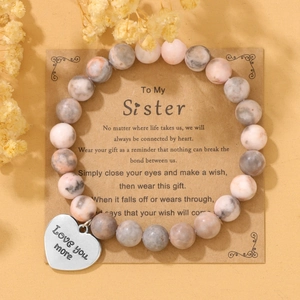 Pink marble bead stretch bracelet with Love You heart pendant on a Sister message card