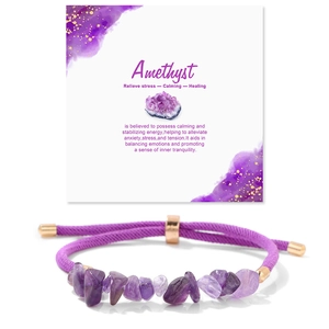 Detail of adjustable purple amethyst stone bracelet with rose gold slider on card