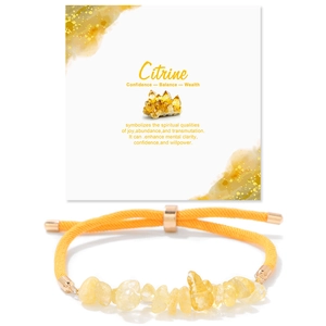 Macro detail of natural citrine stone bracelet with adjustable yellow woven cord