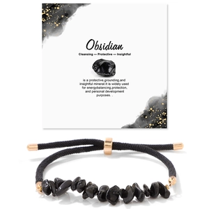 Detail of obsidian chip bracelet with adjustable gold clasp and informative crystal card