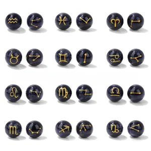 Macro detail of 10mm blue goldstone zodiac beads with fine gold constellation engravings