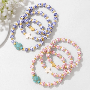 Blue and pink floral porcelain beaded bracelets with heart and turtle charms set