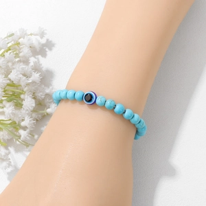 Himmelblaues 6mm Natursteinperlenarmband mit Türkistextur und blauem Auge Symbol
