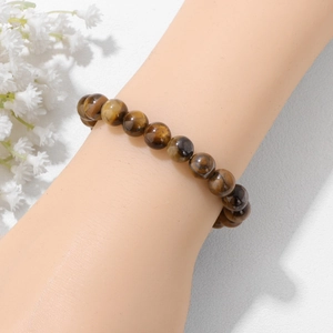 Elastische damesarmband van natuurlijke tijgeroogsteen met goudbruine zijdeglans kralen