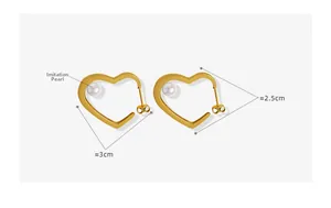 Detailed view of gold hollow heart earrings with imitation pearls and size measurements