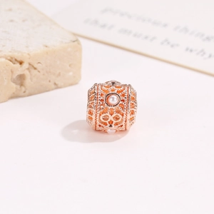 Hollow rose gold bead with white pearls and intricate vintage patterns for DIY jewelry
