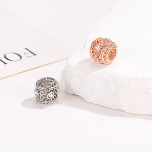 Hollow flower bead charms in silver and rose gold finishes with white pearls