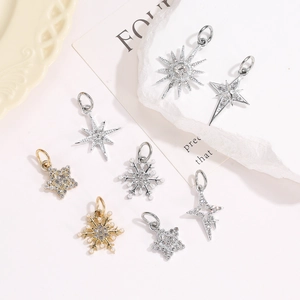 Mixed set of 8 gold and silver star and snowflake charms with cubic zirconia stones