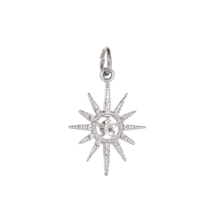 Detailed macro view of an eight-pointed star pendant with silver plating and white zircons