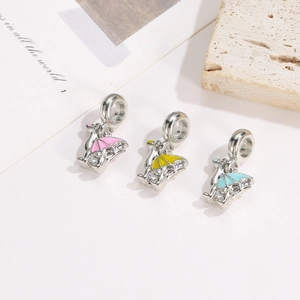 Three dinosaur charm pendants with colorful enamel wings for DIY bracelets and necklaces