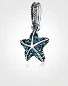 Detailed view of silver starfish charm with sparkling blue and black crystals for DIY jewelry