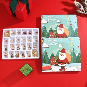 Close-up of Christmas advent calendar box with 24 festive charms and golden bracelets