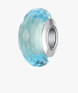 Macro detail of faceted light blue glass bead with silver metal core for DIY bracelets