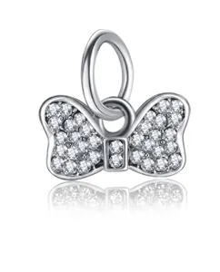 Macro shot of silver bow pendant with sparkling cubic zirconia for DIY jewelry
