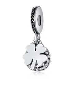 Detailed view of silver four-leaf clover charm pendant with white zircon inlays