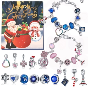 Blue and pink Christmas DIY bracelet kit with charms and beads in a festive holiday gift set