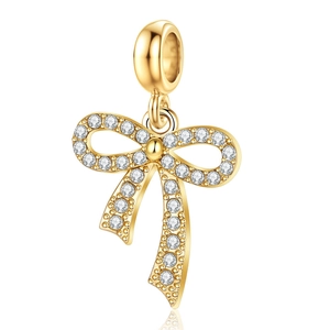 Colgante de lazo dorado con circonitas blancas para la creación de joyería fina