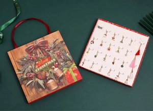 Detailed 24-day Christmas advent calendar gift box with holiday jewelry and charms