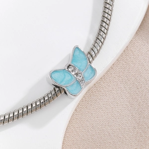 Ethnic style light blue butterfly pendant with rhinestones on a silver snake chain